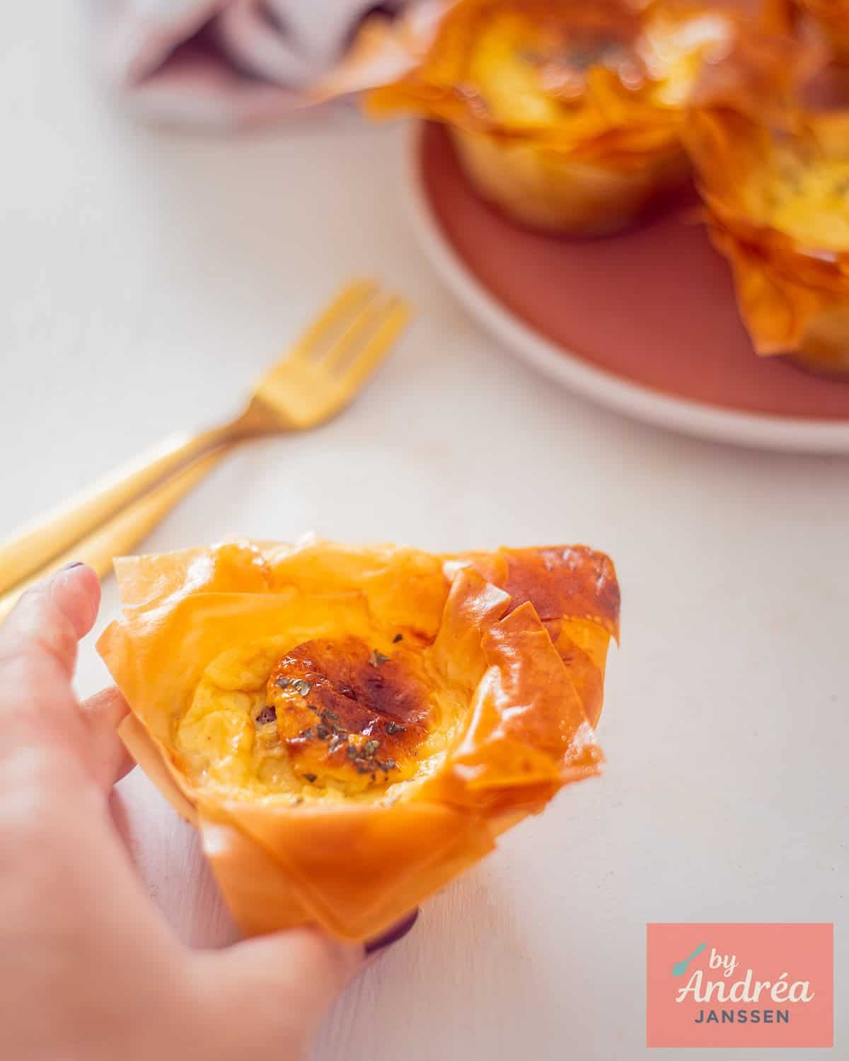 A mini quiche lorraine in front and some more in the back.