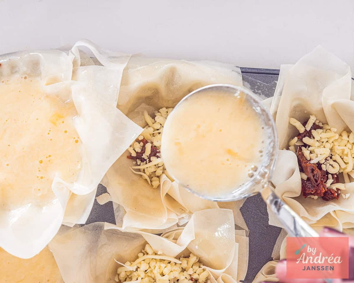 Egg mix is added to the phyllo dough cups