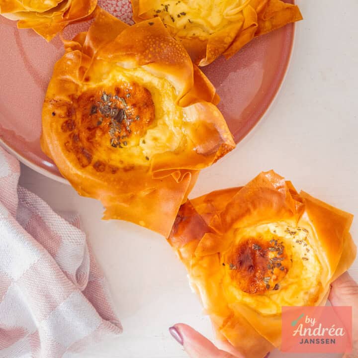 A square picture taken from above with mini quiche Lorraines.