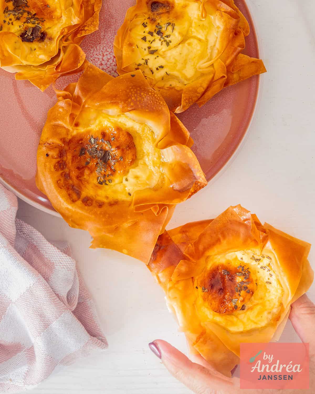 A picture from above from four mini quiche lorraine bites. 