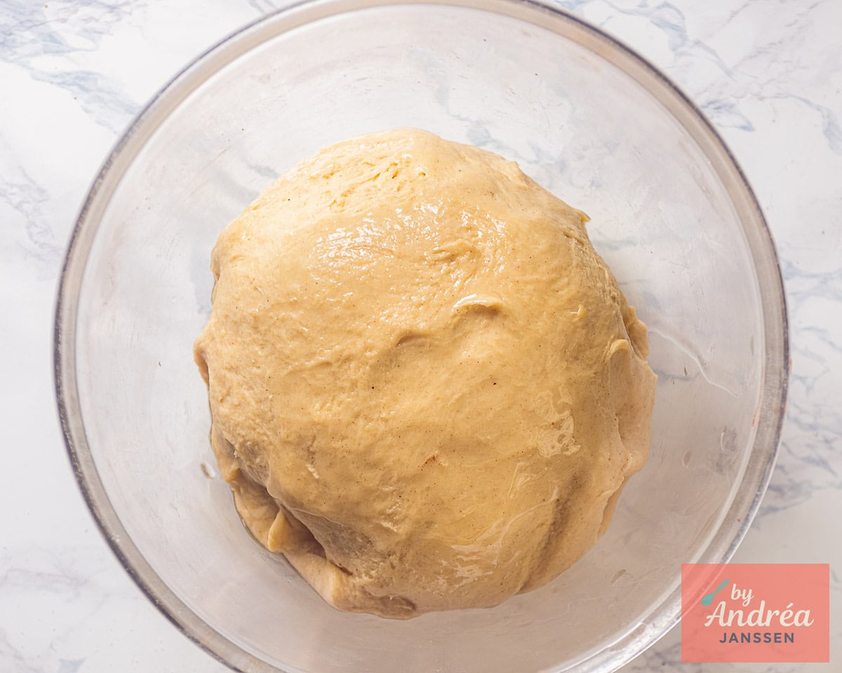 Dough in a glass bowl.