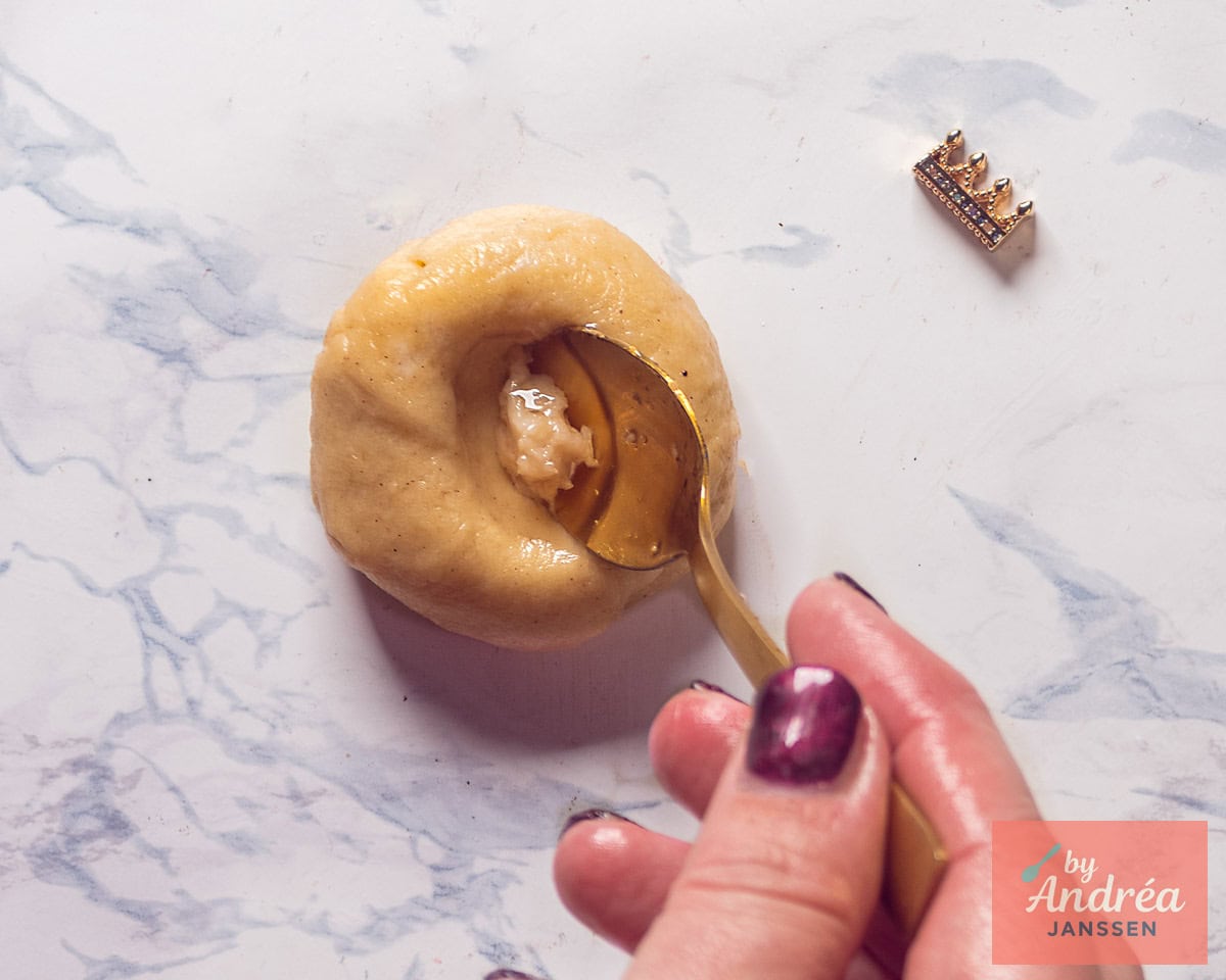 Small ball of dough with an indentation into which garlic is spooned.
