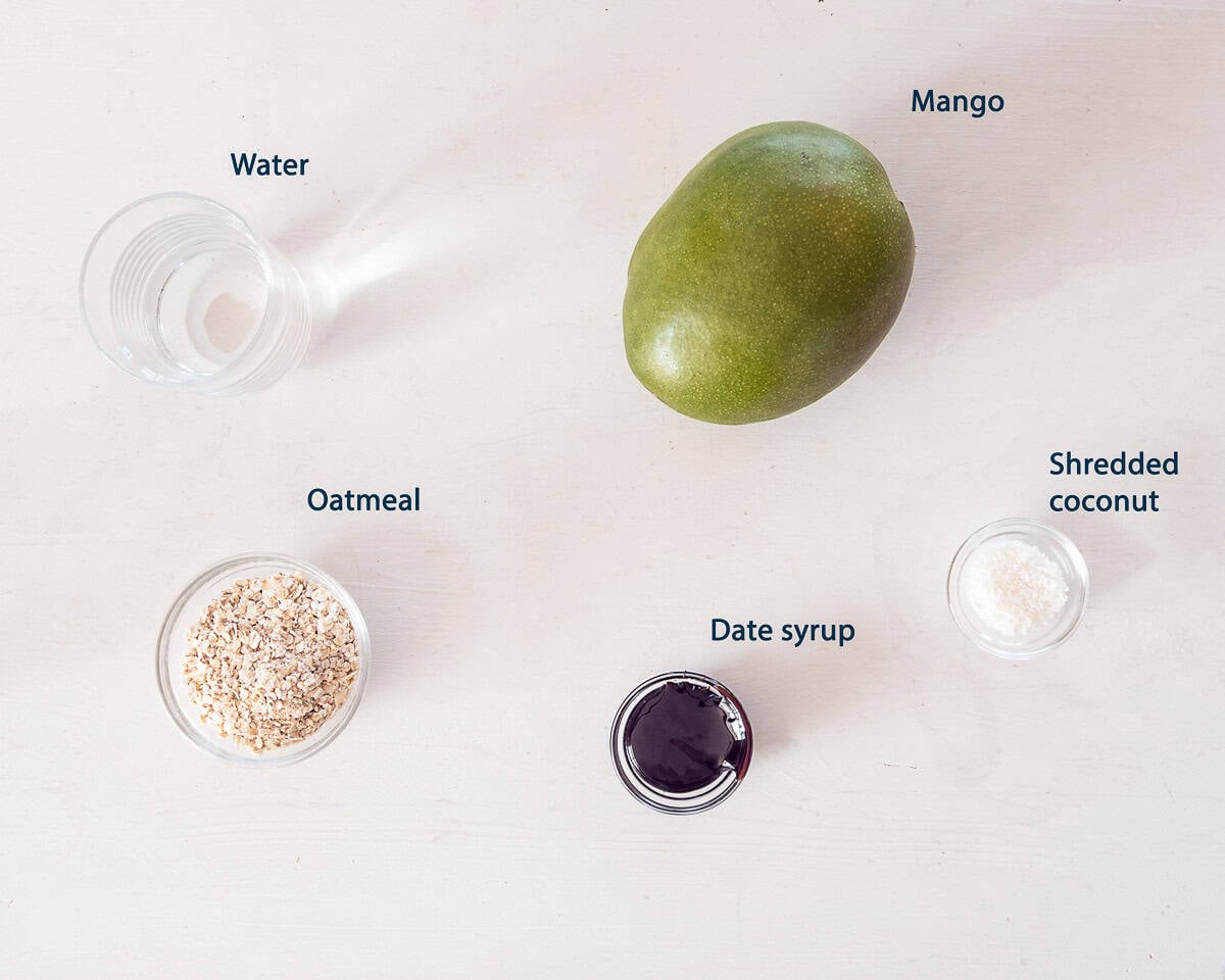 Ingredients mango coconut oatmeal on a white background with text description