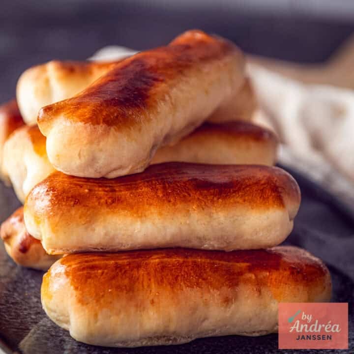 A square picture with a part of a plate with Brabantse worstenbroodjes