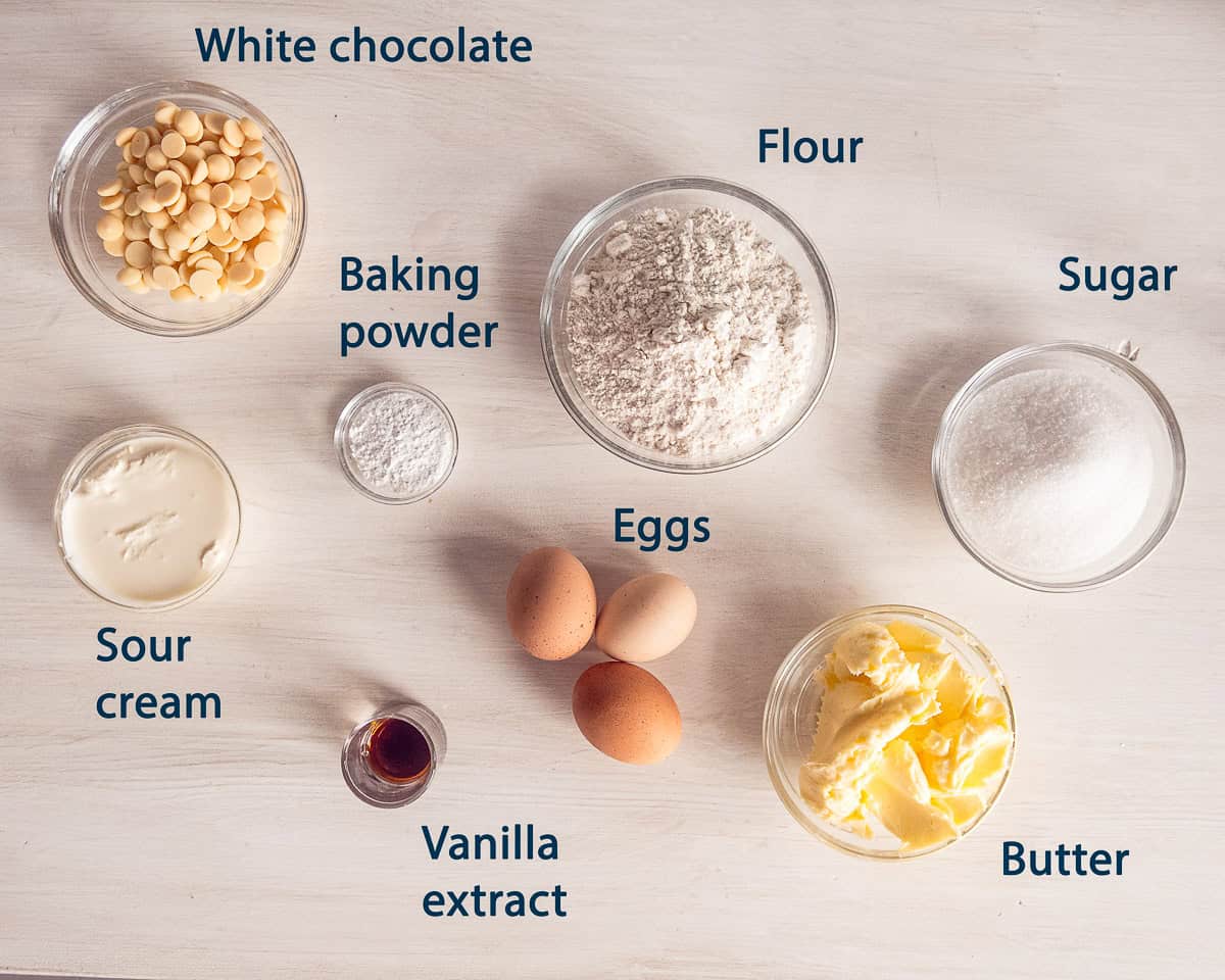 ingredients White Chocolate Cake on a beige background with text description.