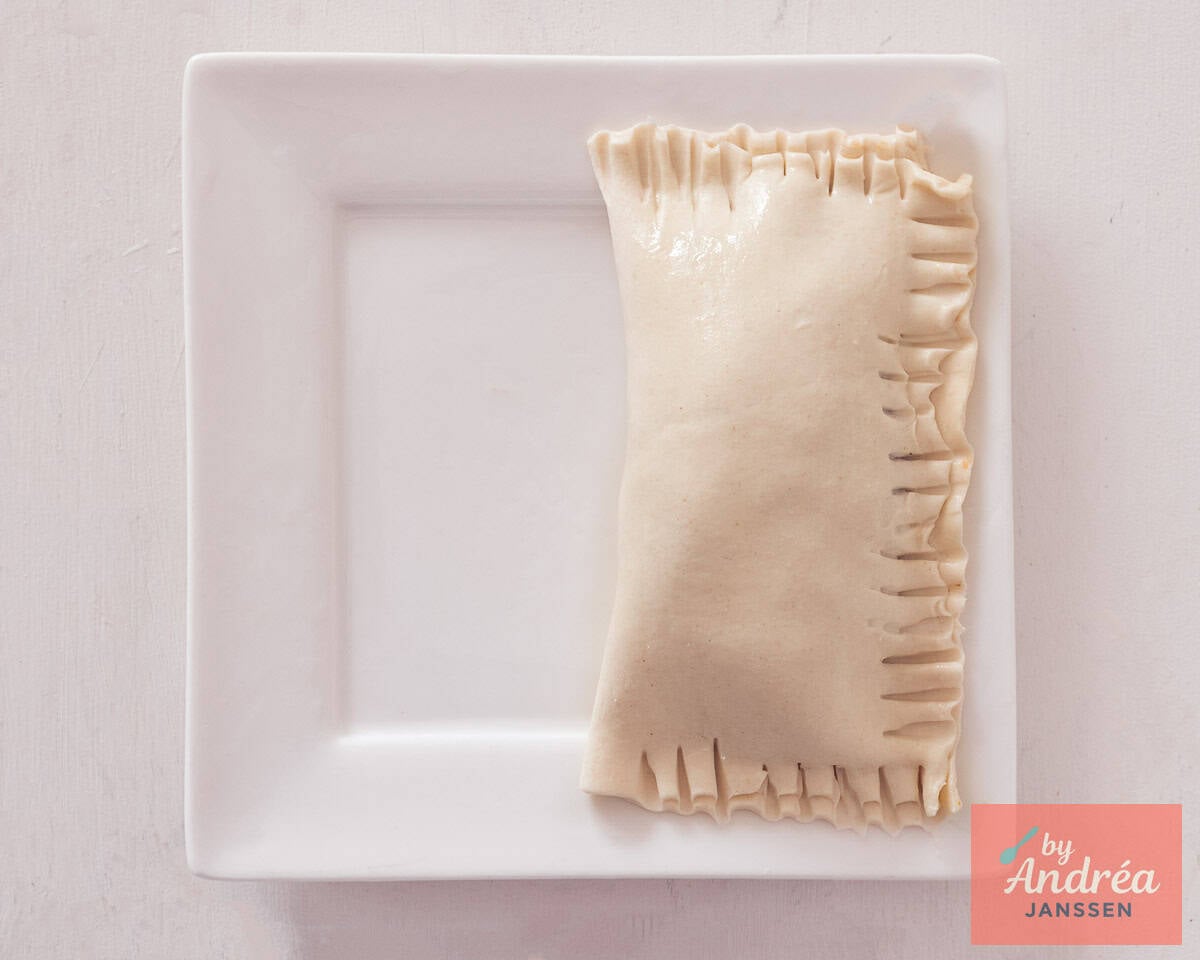 Puff pastry folded over ground beef and tight.