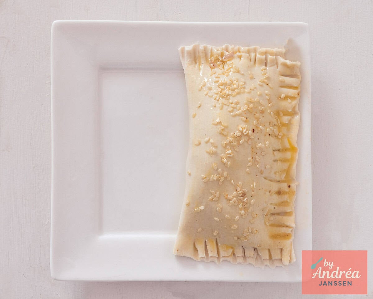 oriental sausage rolls with sesame seeds