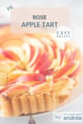 Part of an apple pie in the shape of a rose on a white surface. A text at the top: Rose Apple Tart, baking, easy recipe