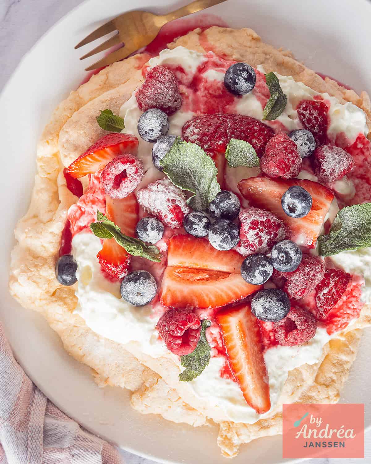 Pavlova with Strawberries, Raspberries, Blueberries and Mint