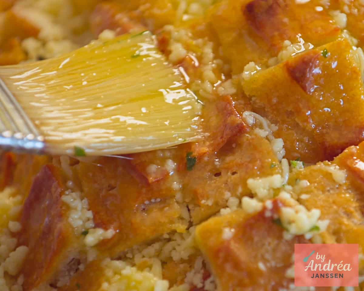 Spread pull-apart bread with garlic butter and sprinkle with parsley and Maldon salt