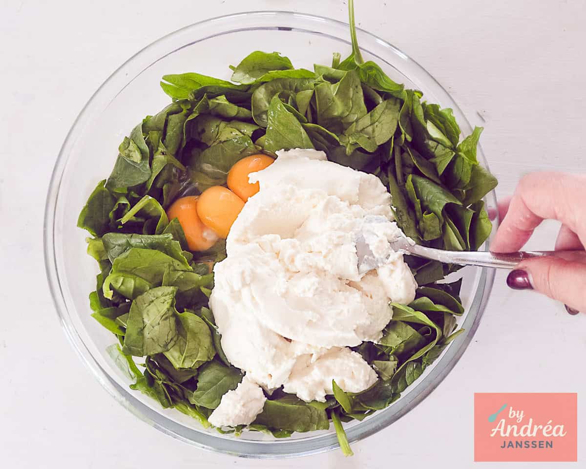 Make the filling for katmer pie with spinach, eggs, ricotta, and salt.
