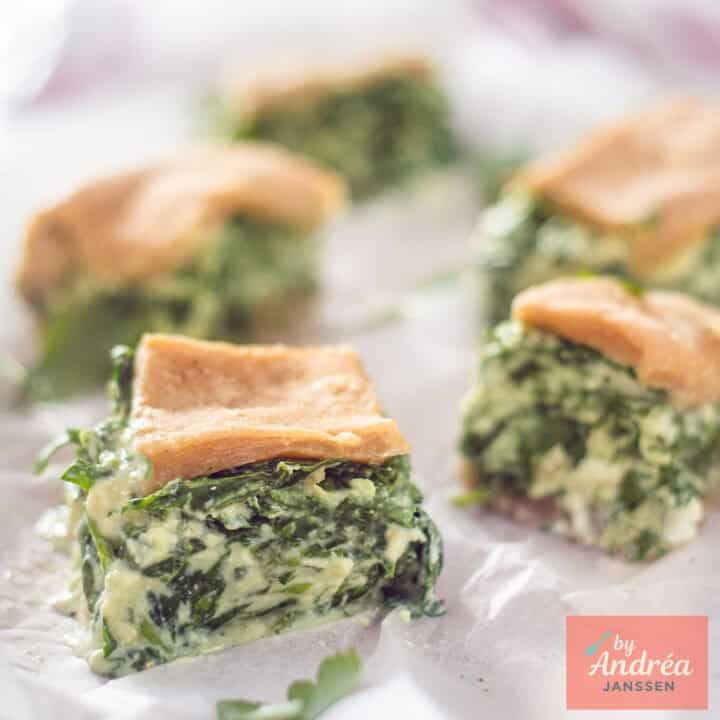 A square photo with a savory pie with homemade dough and spinach filling