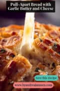 Close-up of pull-apart bread with garlic butter as a piece is lifted, showing melted cheese strings a text on top: Pull-Apart Bread with Garlic Butter and Cheese