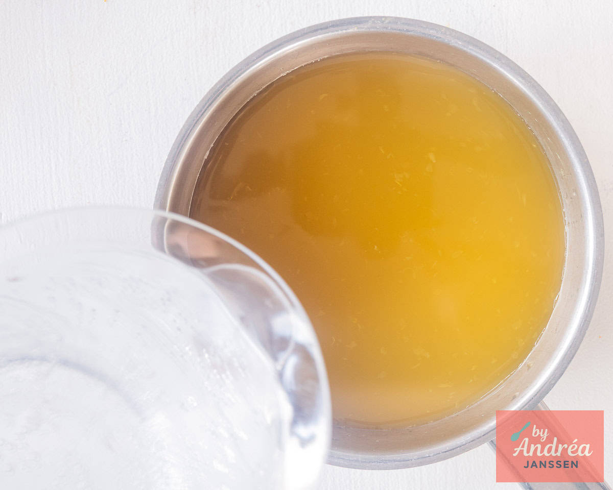 Sparkling water is added to the tea with orange juice.