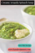 Arugula spinach soup with crème fraîche in a white bowl. A text at the top reads: Creamy Arugula Spinach Soup