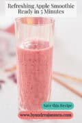 A glass of cranberry and apple smoothie. A text: Apple and cranberry smoothie - a fresh start.
