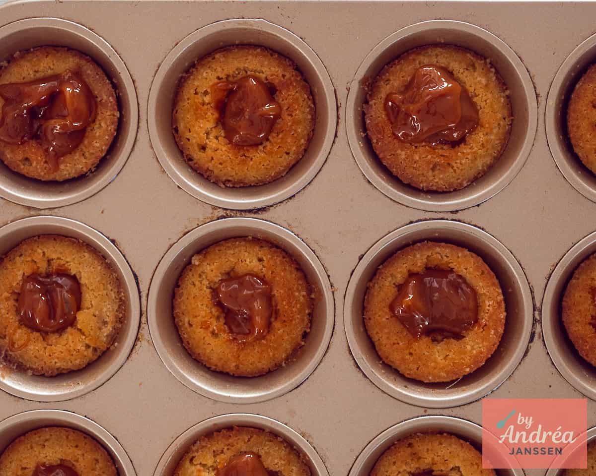 The wholes in the baked cupcakes are filled with caramel