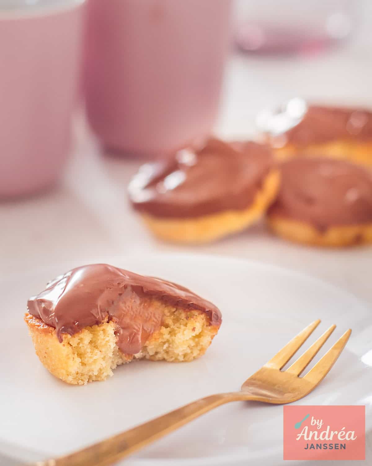 Four twix cupcakes one halved, the insides visible.