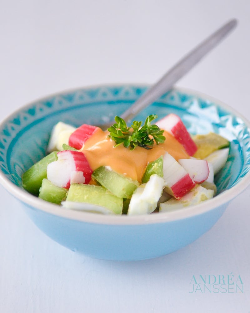 a bowl with surimi salad with homemade cocktail sauce