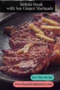 A black plate with strips of sirloin steak, ginger, and a delicious sauce. Text: sirloin steak with soy ginger marinade
