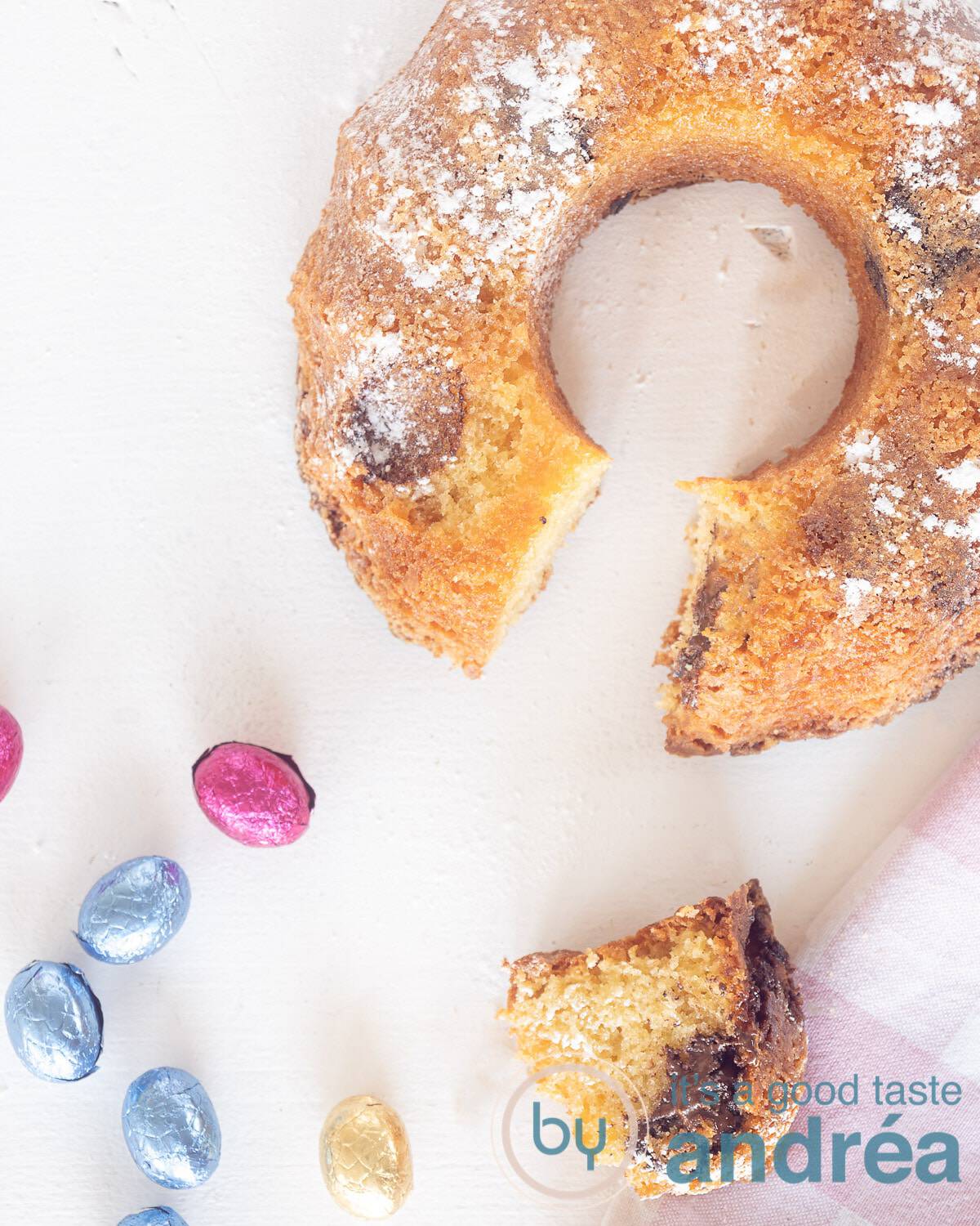 A top photo of a turban with a slice taken out (on the bottom) and some chocolate eggs