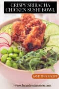 Pink bowl with sushi rice, edamame, seaweed, radish, crispy chicken, and avocado, with text overlay “Crispy Sriracha Chicken Sushi Bowl”