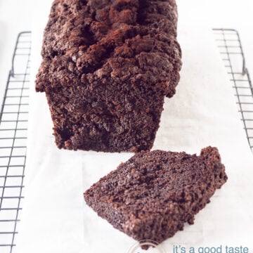 Chocolate zucchini cake on baking paper on a rack