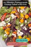 A photo of a mixed salad with goldenberries, sesame seeds, orange tomatoes, and pomegranate with feta. A caption at the top reads: 10-Minute Pomegranate Orange Salad with Feta