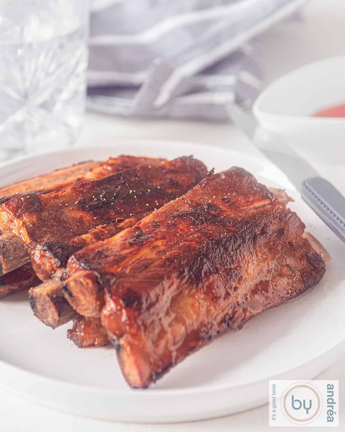 A plate of sticky ribs with honey, soy sauce, ketjap and whisky glaze.