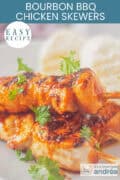 Three chicken skewers with BBQ sauce and bacon, text: easy recipe, bourbon bbq chicken skewers