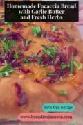 A portion of focaccia with caramelized onions, fresh herbs, and garlic butter. A text: Homemade Focaccia Bread with Garlic Butter and Fresh Herbs