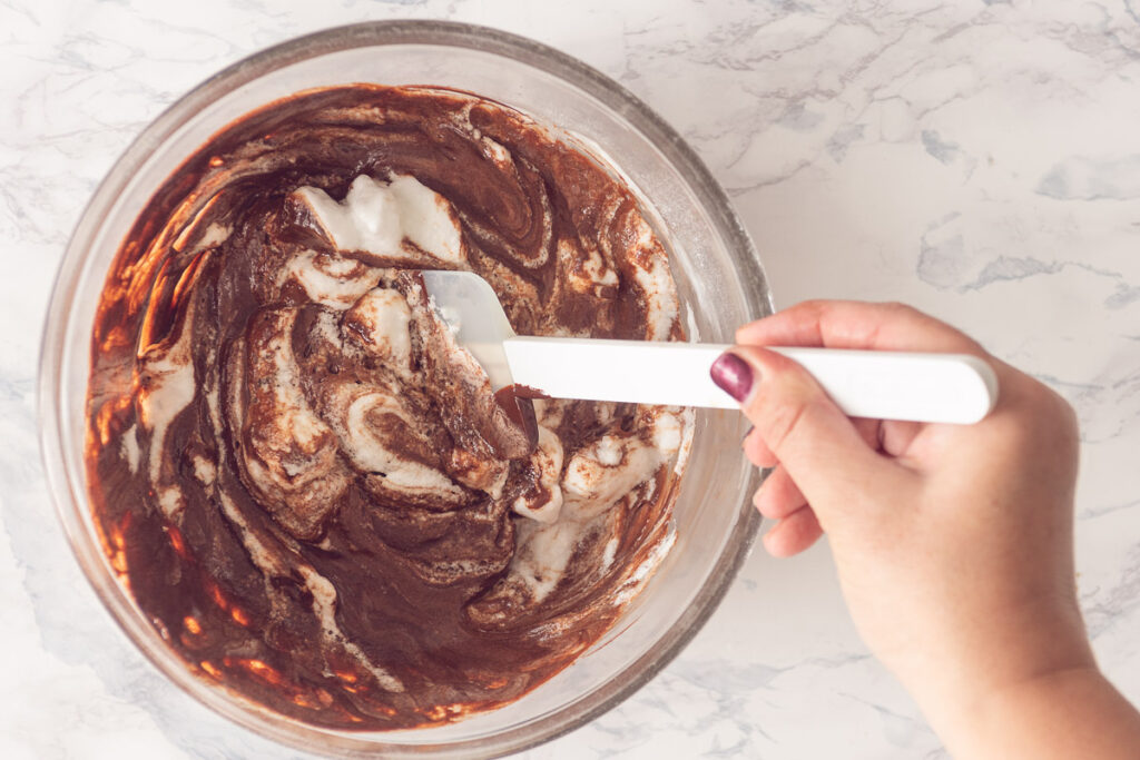 combine egg whites with chocolate cream mousse