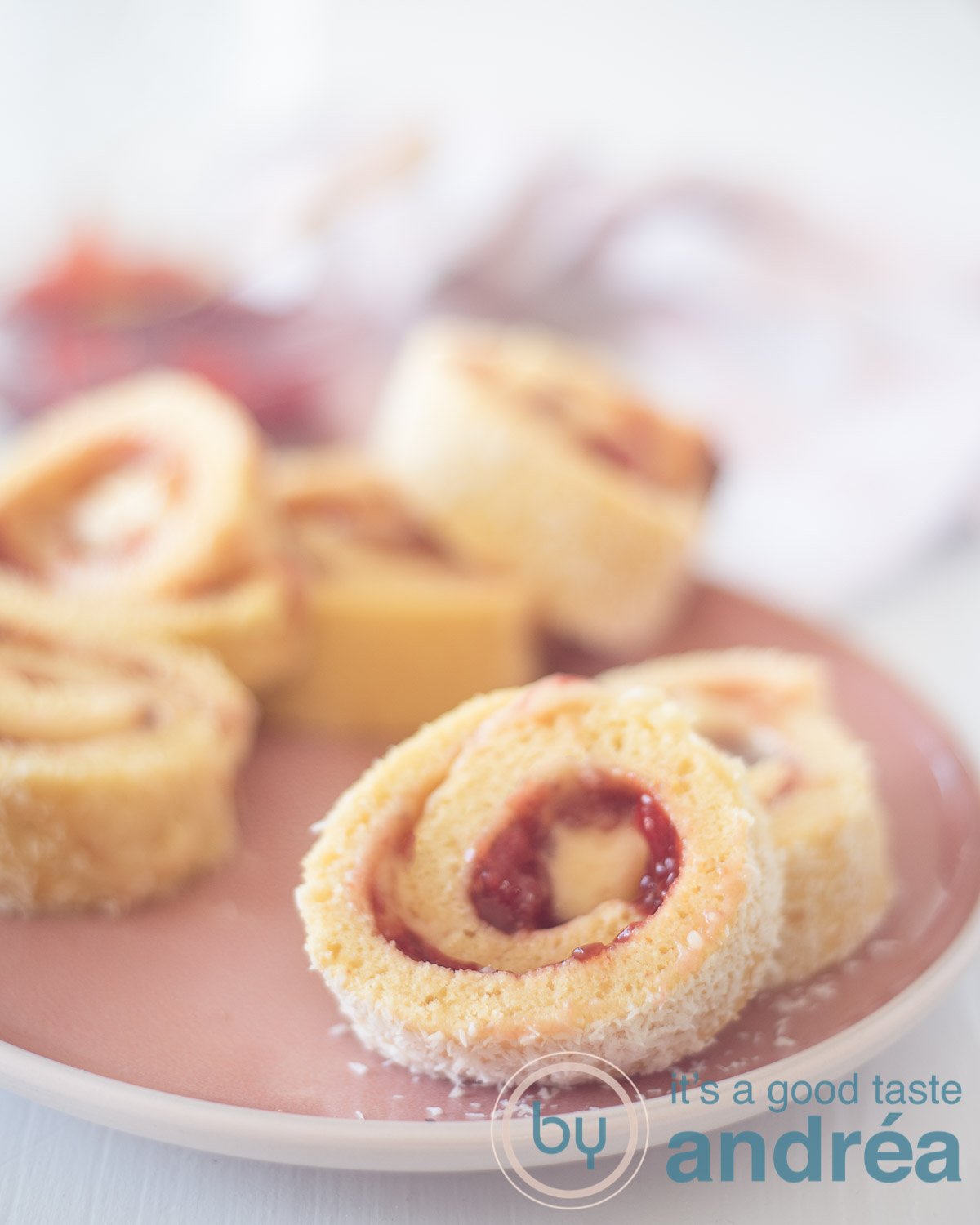 Strawberry cake rolls on a white plate