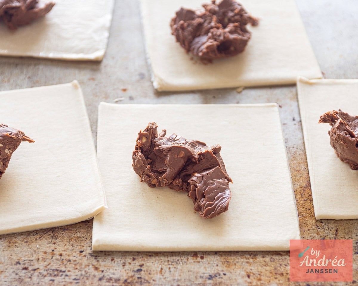 Puff pastry sheet with some chocolate on top.