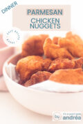 Half a pink bowl filled with baking paper and chicken nuggets. A white background. A text overlay chicken nuggets homemade dinner, easy recipe,