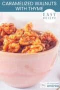 A pink bowl with candied walnuts with thyme. A text at the top: easy recipe, caramelized walnuts with thyme