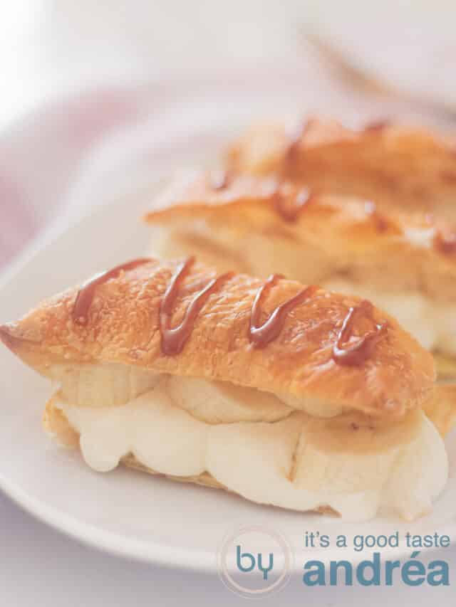 banana Napoleon with caramel sauce on top of a white plate (three treats)