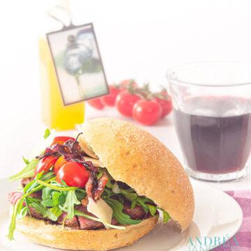Sandwich with grilled steak and caramelized onions