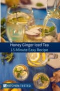 Two glasses of honey ginger iced tea with fresh lemon slices, ginger root, and mint leaves, being poured on a blue table.