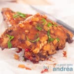 baking paper with pieces sweet spare ribs with homemade bbq sauce