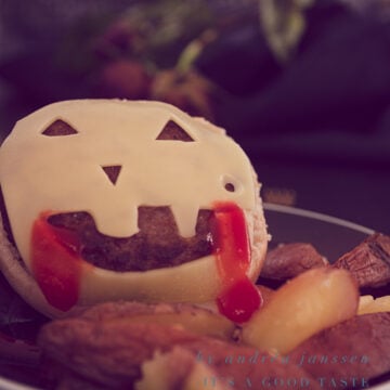 Cheeseburger with homemade oven-baked fries for Halloween