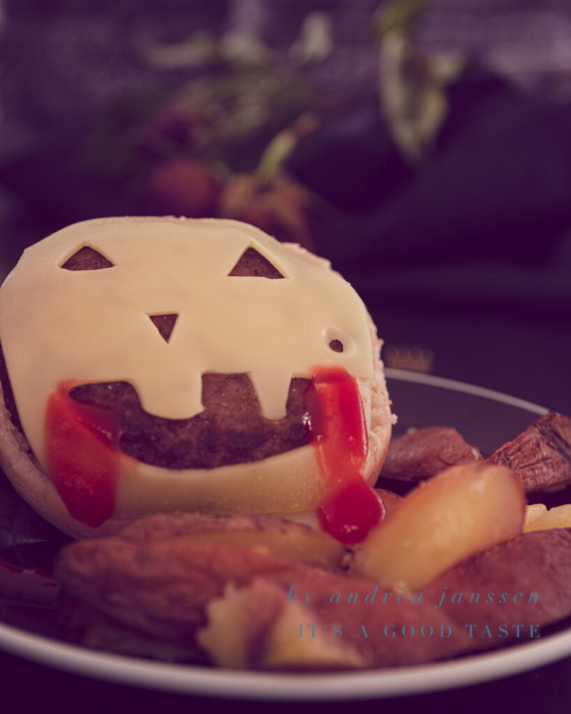 Cheeseburger with homemade oven-baked fries for Halloween