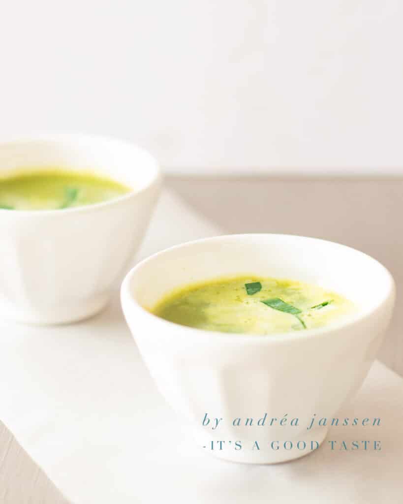 two bowls of soup with fresh peas