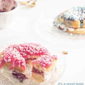 two donuts on glas plates, pink and blue and some jelly