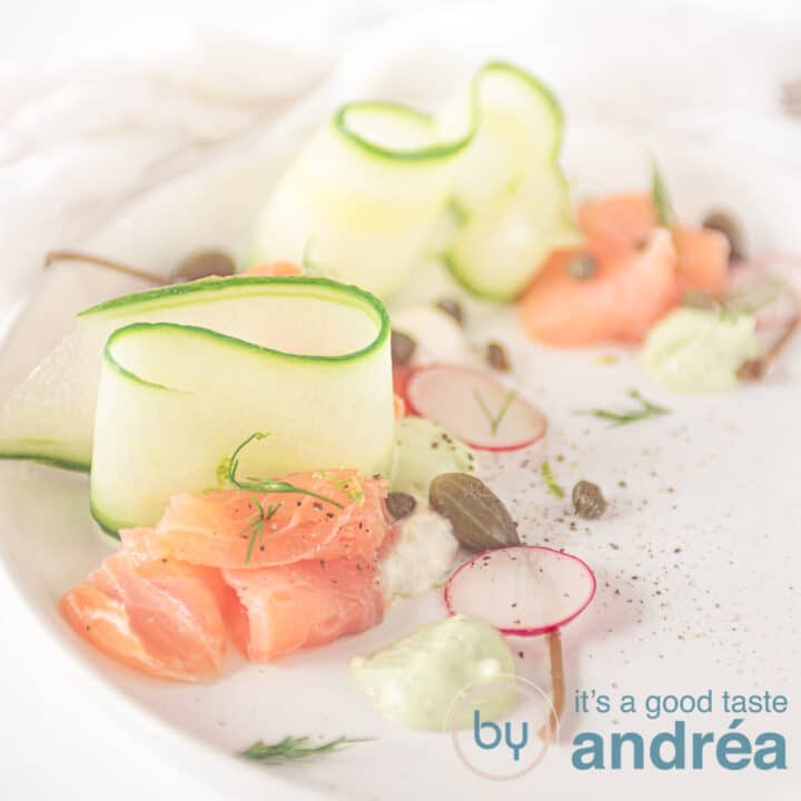 square picture of smoked salmon, cucumber ribbons and cream