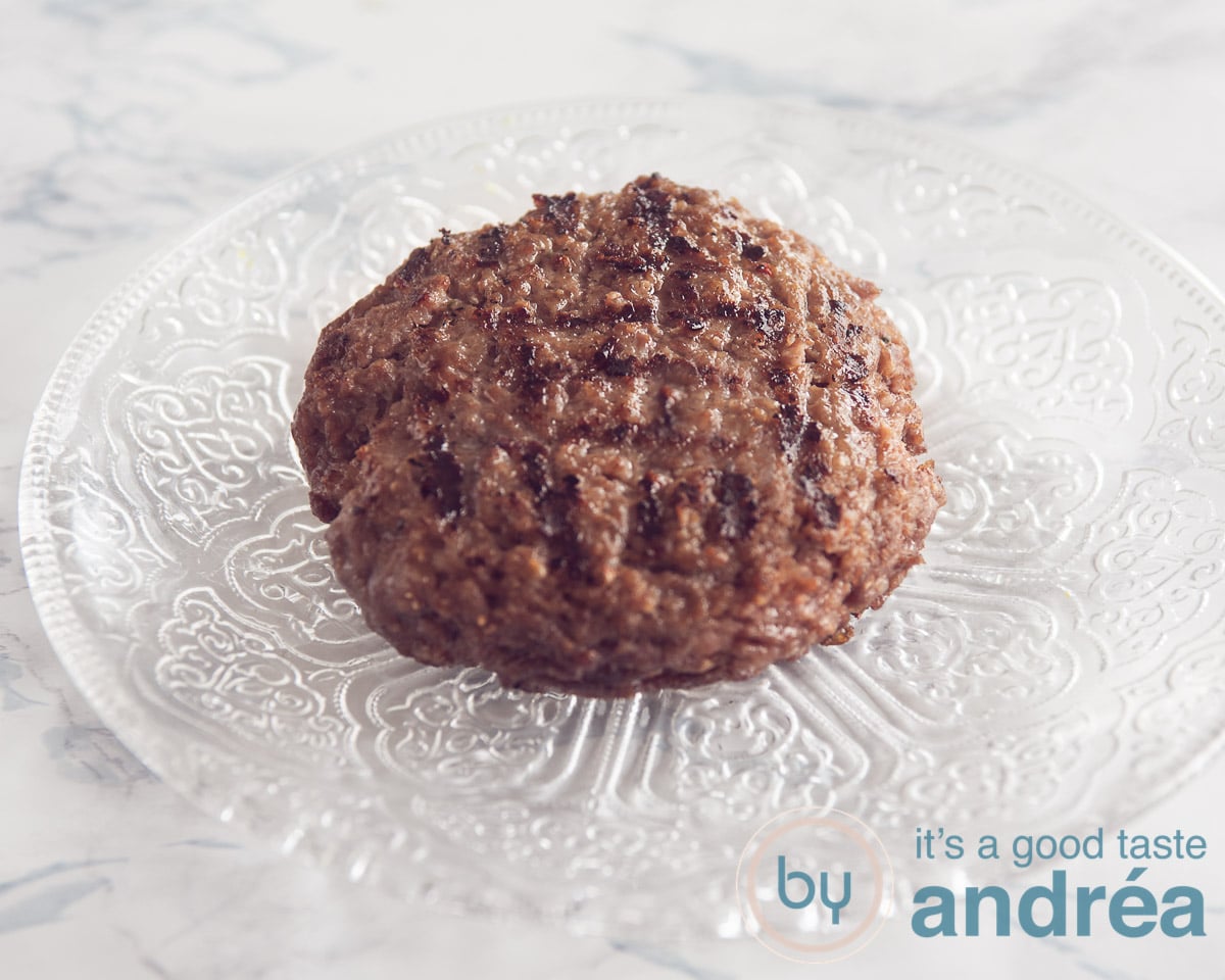 Grilled hamburger on a glass plate