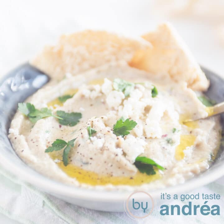 a square photo with a great bowl with Greek eggplant dip topped with olive oil and herbs