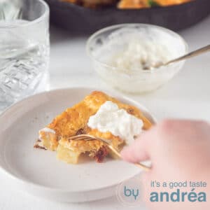 a square photo of a piece of Spanish frittata and a fork taking a bite.