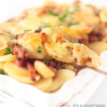 A spoon takes a bite of potato out of the oven dish differently.