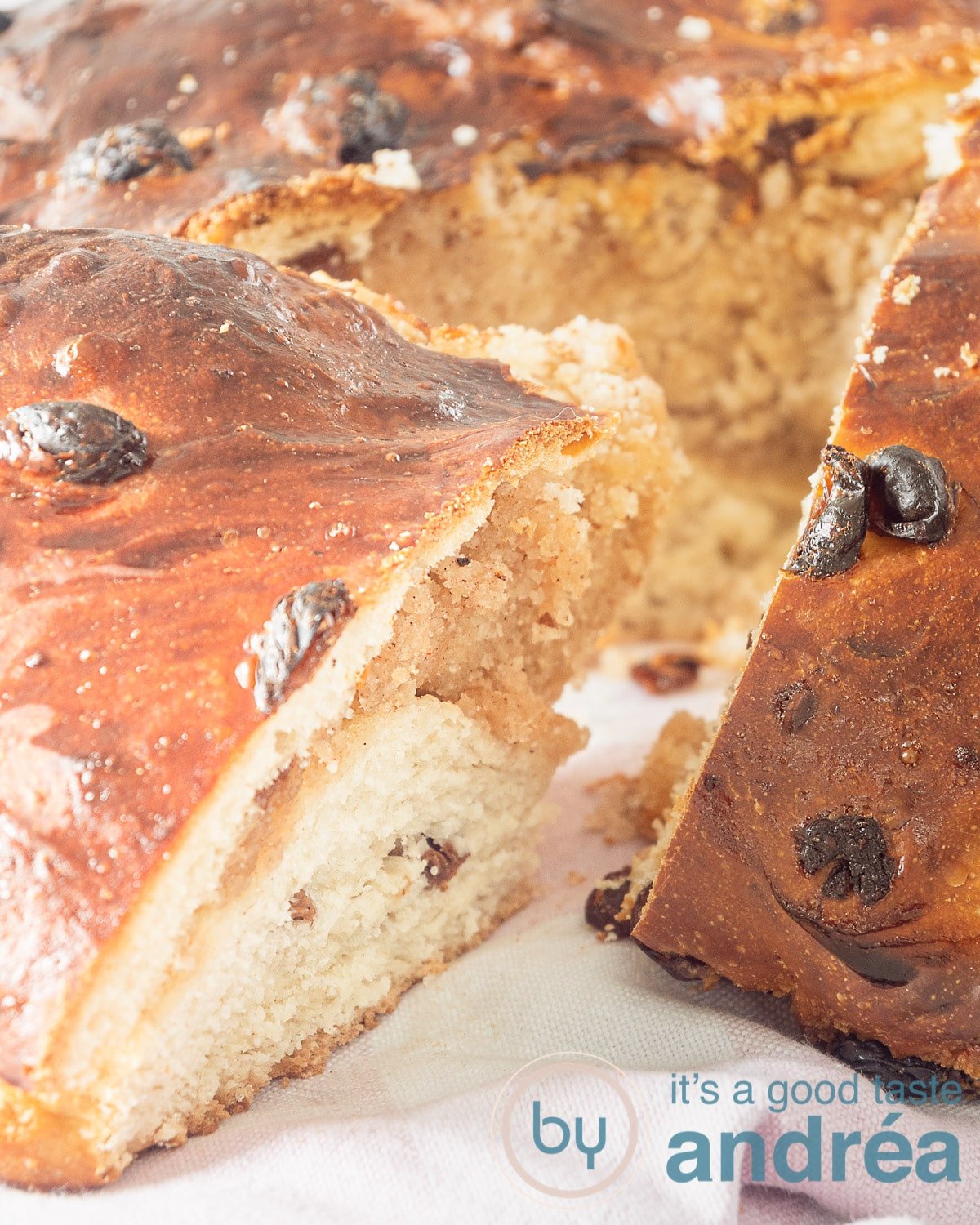 A piece of Brabant brother cut from the bread. The raisins and almond paste filling are clearly visible.